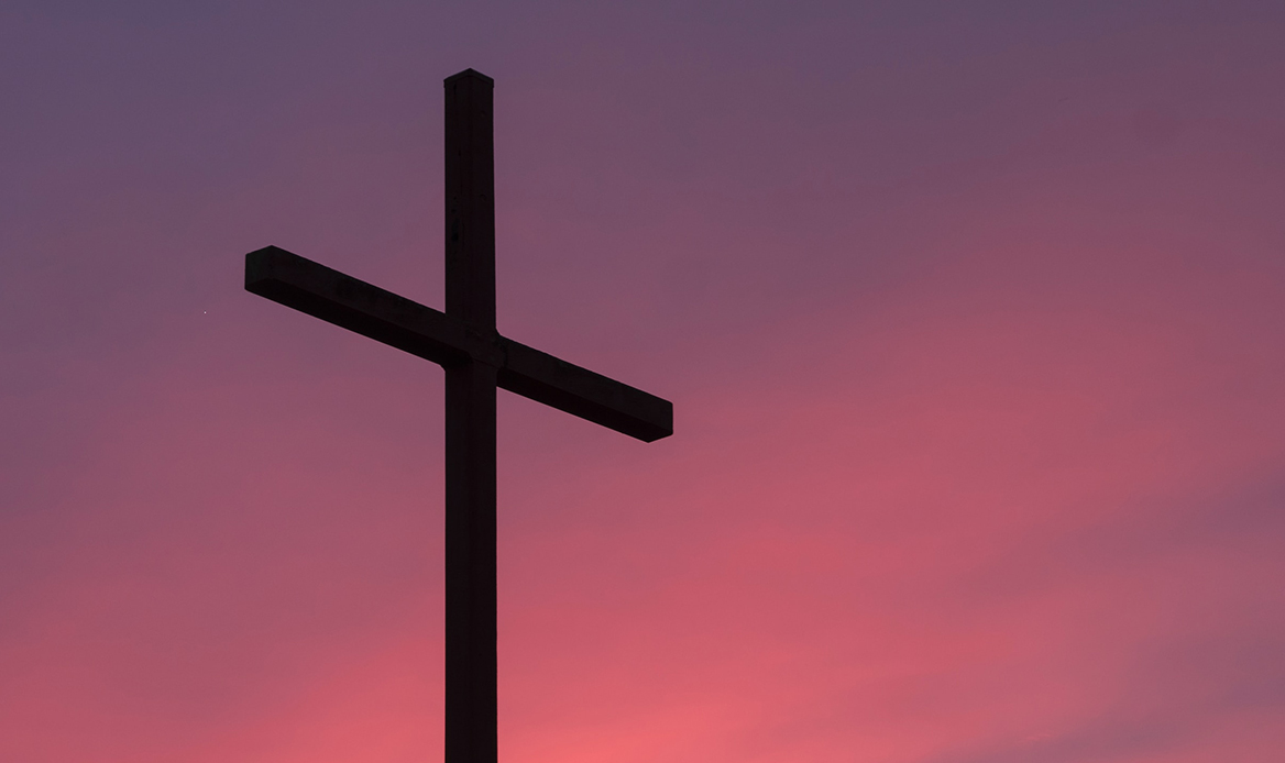 Cross with a red sunset